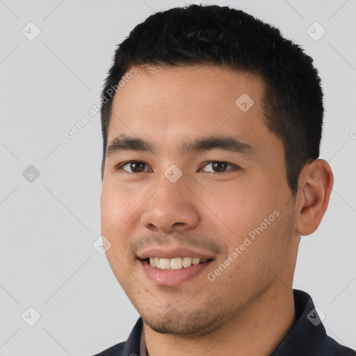 Joyful white young-adult male with short  black hair and brown eyes