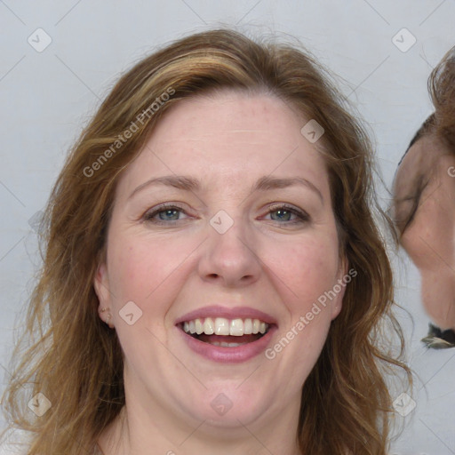 Joyful white adult female with medium  brown hair and blue eyes