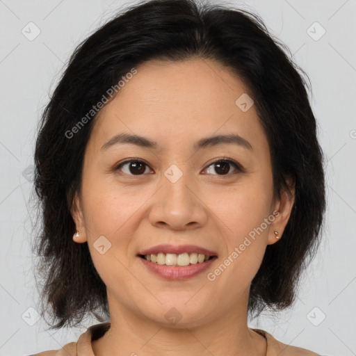 Joyful latino young-adult female with medium  brown hair and brown eyes