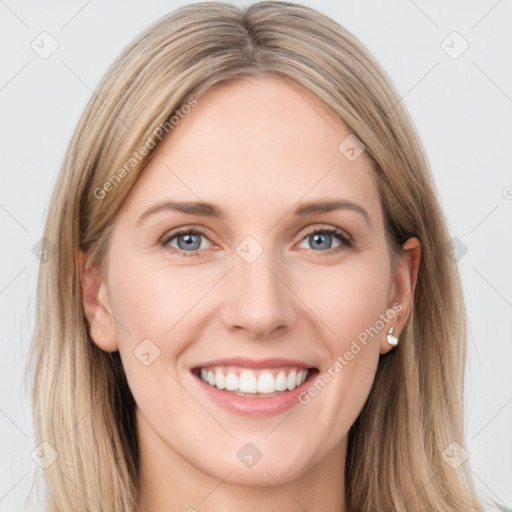 Joyful white young-adult female with long  brown hair and blue eyes