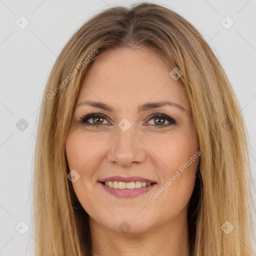 Joyful white young-adult female with long  brown hair and brown eyes