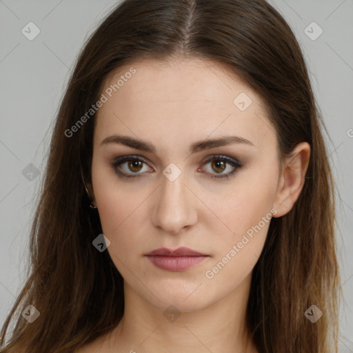 Neutral white young-adult female with long  brown hair and brown eyes