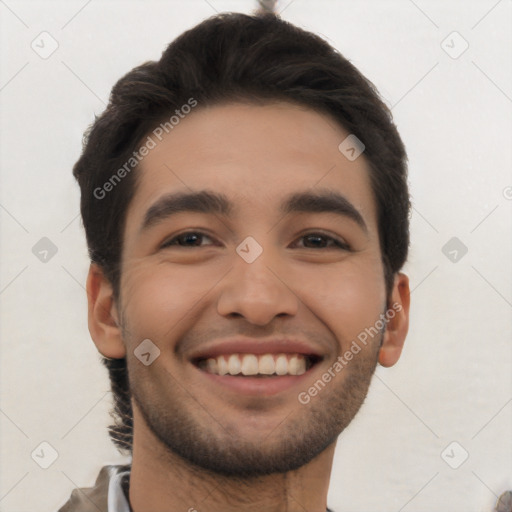 Joyful white young-adult male with short  black hair and brown eyes