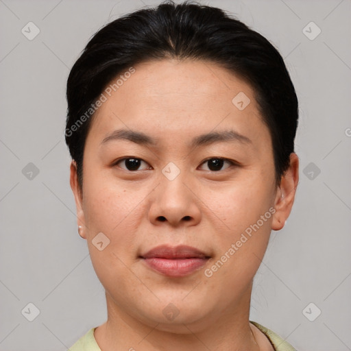 Joyful asian young-adult female with short  brown hair and brown eyes