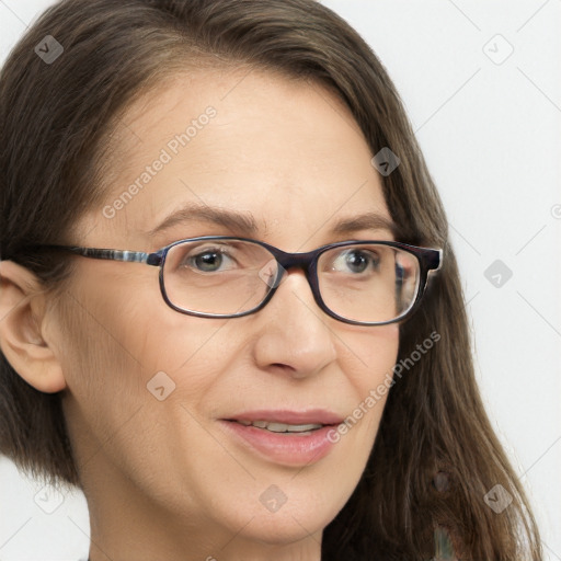 Joyful white adult female with long  brown hair and brown eyes