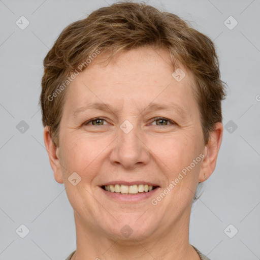 Joyful white adult female with short  brown hair and grey eyes