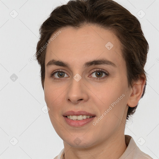 Joyful white young-adult female with short  brown hair and brown eyes