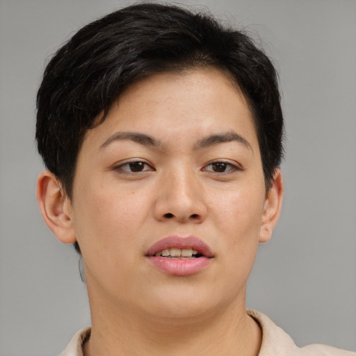 Joyful asian young-adult female with short  brown hair and brown eyes