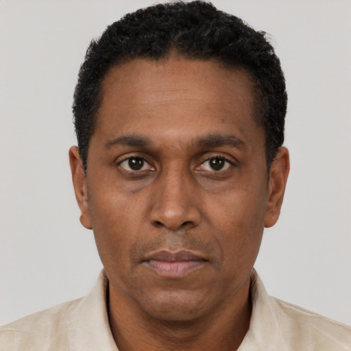Neutral latino adult male with short  black hair and brown eyes