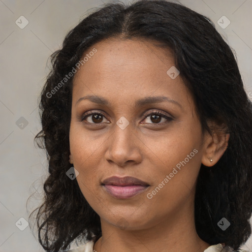 Joyful black adult female with medium  brown hair and brown eyes