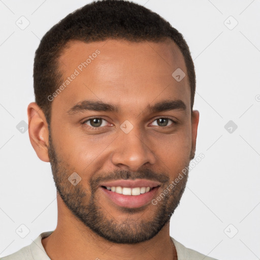 Joyful black young-adult male with short  brown hair and brown eyes