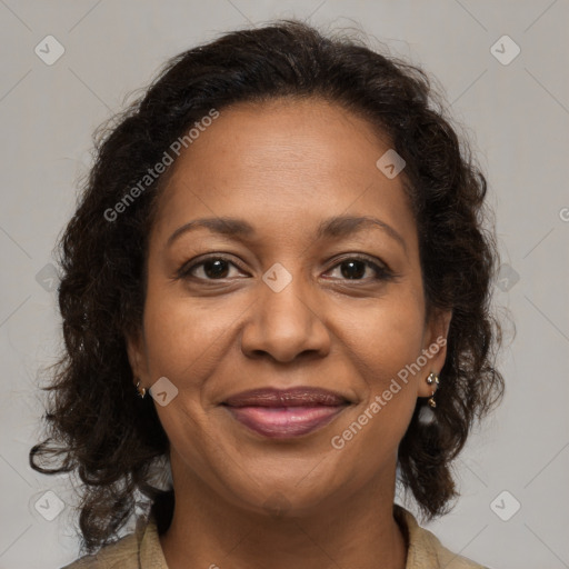 Joyful black adult female with medium  brown hair and brown eyes