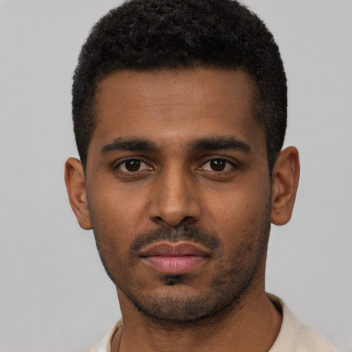 Neutral black young-adult male with short  black hair and brown eyes