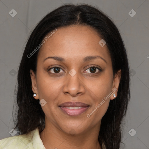 Joyful black young-adult female with long  brown hair and brown eyes