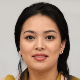 Joyful asian young-adult female with medium  brown hair and brown eyes