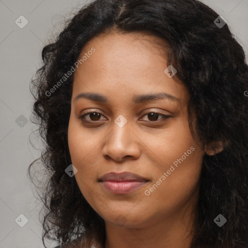 Joyful black young-adult female with long  brown hair and brown eyes