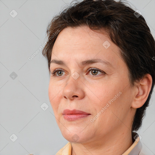 Joyful white adult female with short  brown hair and brown eyes