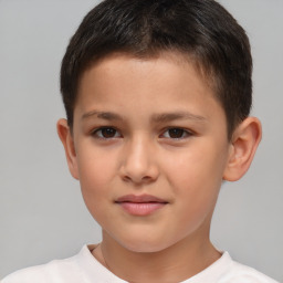 Joyful white child male with short  brown hair and brown eyes