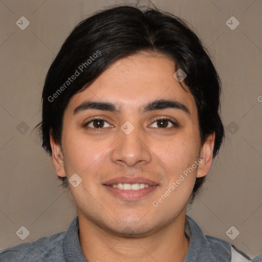 Joyful white young-adult male with short  black hair and brown eyes