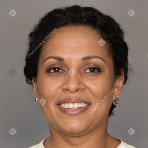 Joyful black adult female with short  brown hair and brown eyes