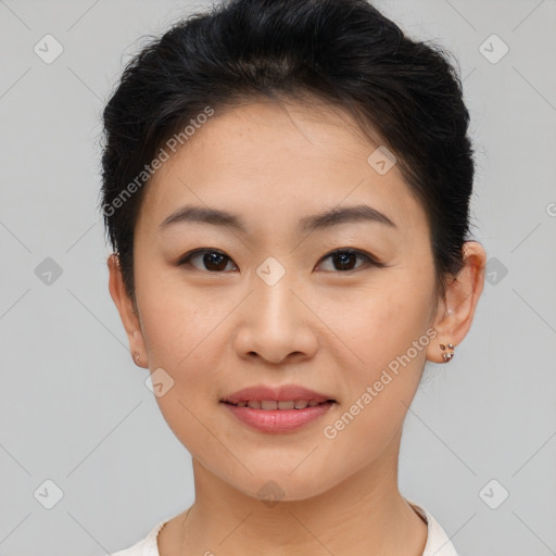 Joyful asian young-adult female with short  brown hair and brown eyes