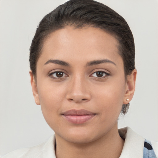 Joyful white young-adult female with short  brown hair and brown eyes