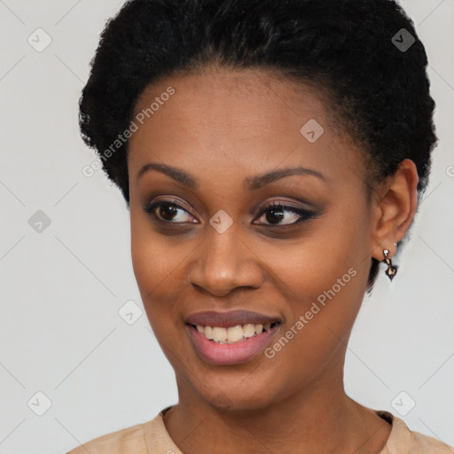 Joyful black young-adult female with short  black hair and brown eyes