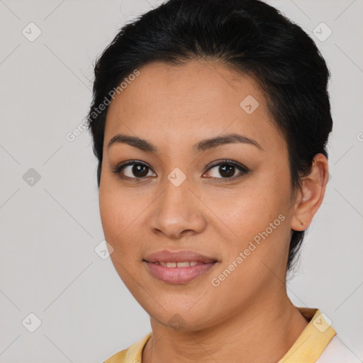 Joyful latino young-adult female with short  brown hair and brown eyes