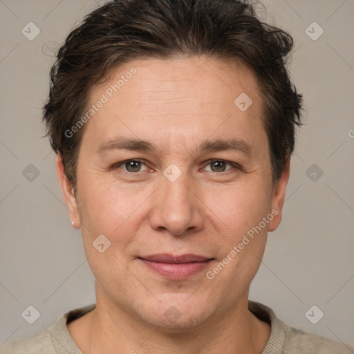 Joyful white adult male with short  brown hair and grey eyes