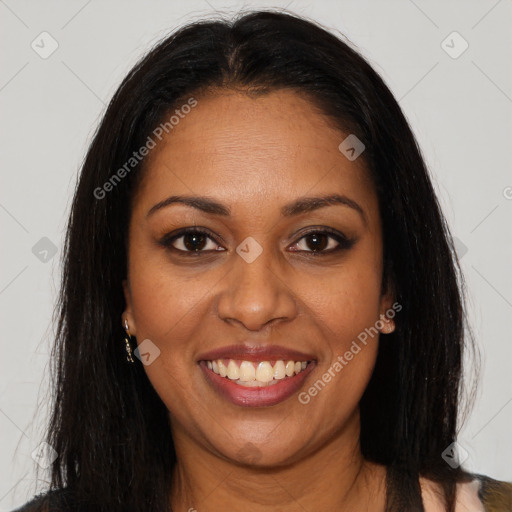 Joyful black young-adult female with long  brown hair and brown eyes