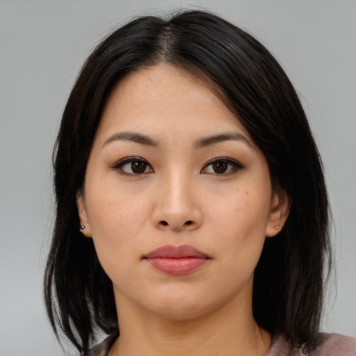 Neutral asian young-adult female with medium  brown hair and brown eyes