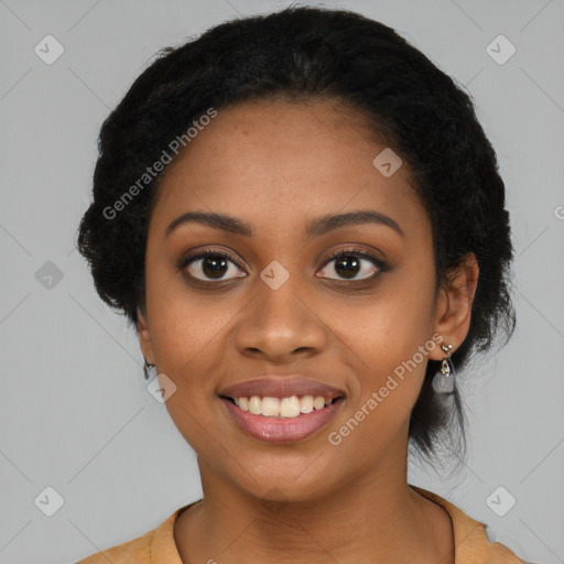 Joyful black young-adult female with long  black hair and brown eyes