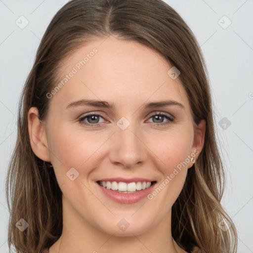 Joyful white young-adult female with long  brown hair and grey eyes