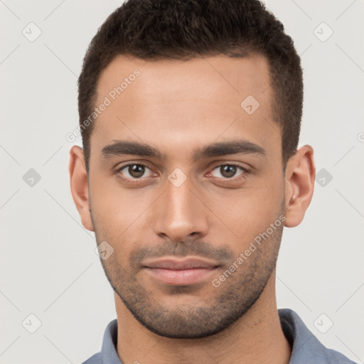 Neutral white young-adult male with short  brown hair and brown eyes