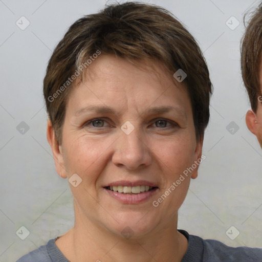 Joyful white adult female with short  brown hair and grey eyes