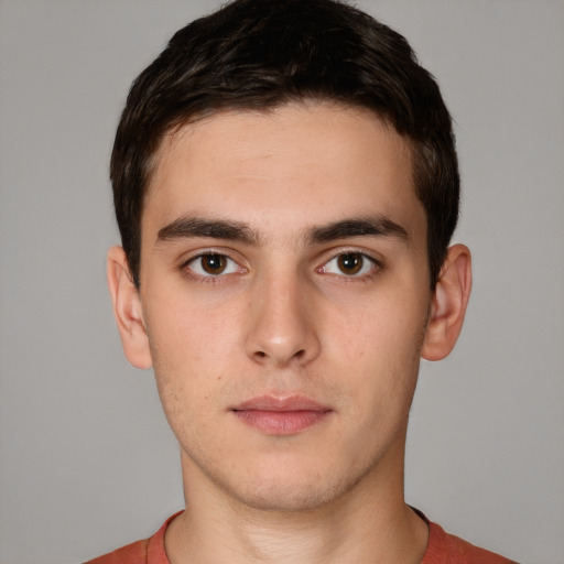 Neutral white young-adult male with short  brown hair and brown eyes