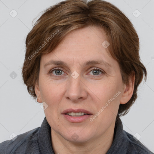 Joyful white adult female with medium  brown hair and grey eyes