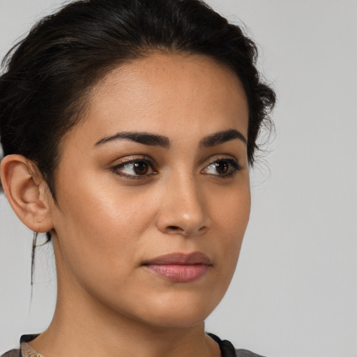 Neutral latino young-adult female with medium  brown hair and brown eyes
