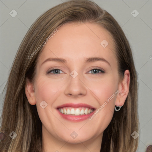 Joyful white young-adult female with long  brown hair and grey eyes