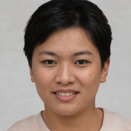 Joyful asian young-adult female with short  black hair and brown eyes