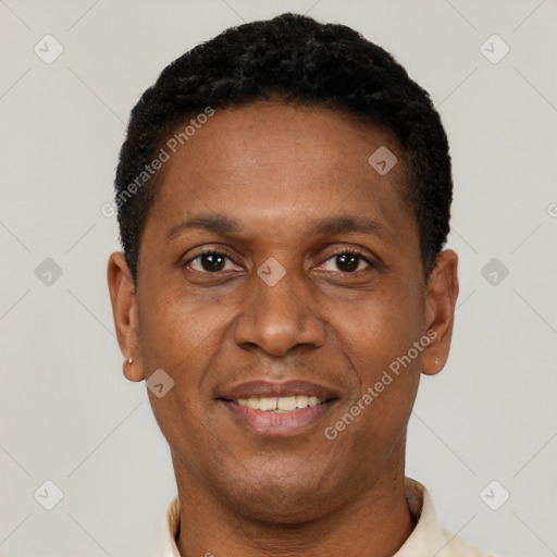 Joyful latino adult male with short  black hair and brown eyes
