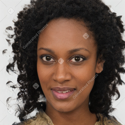 Joyful black young-adult female with medium  brown hair and brown eyes