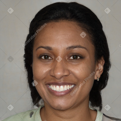 Joyful latino adult female with medium  brown hair and brown eyes