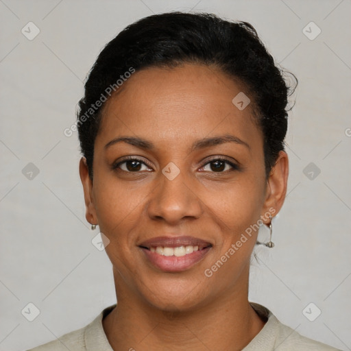 Joyful black young-adult female with short  black hair and brown eyes