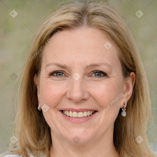 Joyful white adult female with medium  brown hair and grey eyes