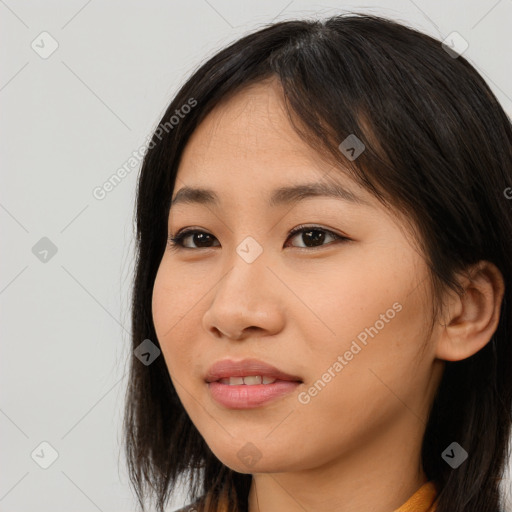 Joyful asian young-adult female with long  brown hair and brown eyes