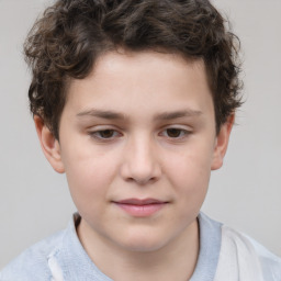 Joyful white child male with short  brown hair and brown eyes