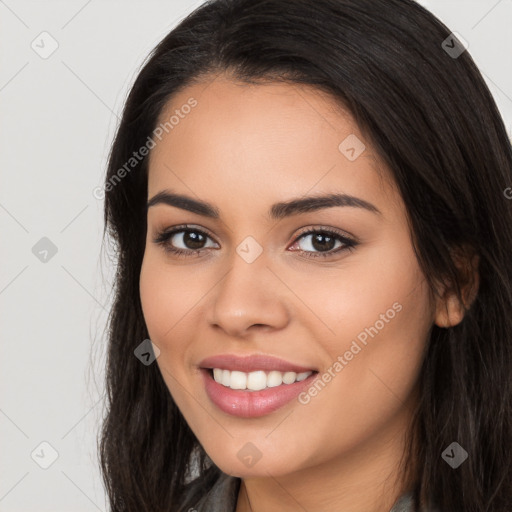 Joyful white young-adult female with long  black hair and brown eyes