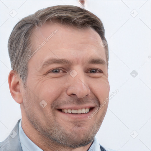 Joyful white adult male with short  brown hair and brown eyes