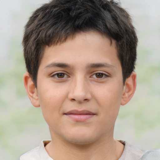 Joyful white child male with short  brown hair and brown eyes